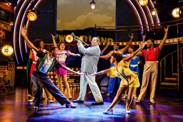 James Monroe Iglehart, center, as Louis Armstrong at company in A Wonderful World ©Jeremy Daniel